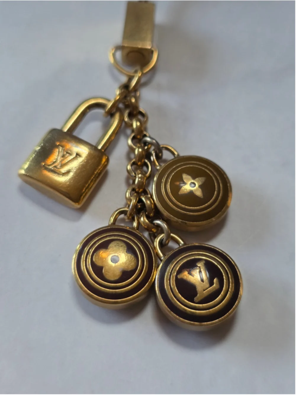 Louis Vuitton Gold-Tone Monogram Lock & Charm Phone Strap